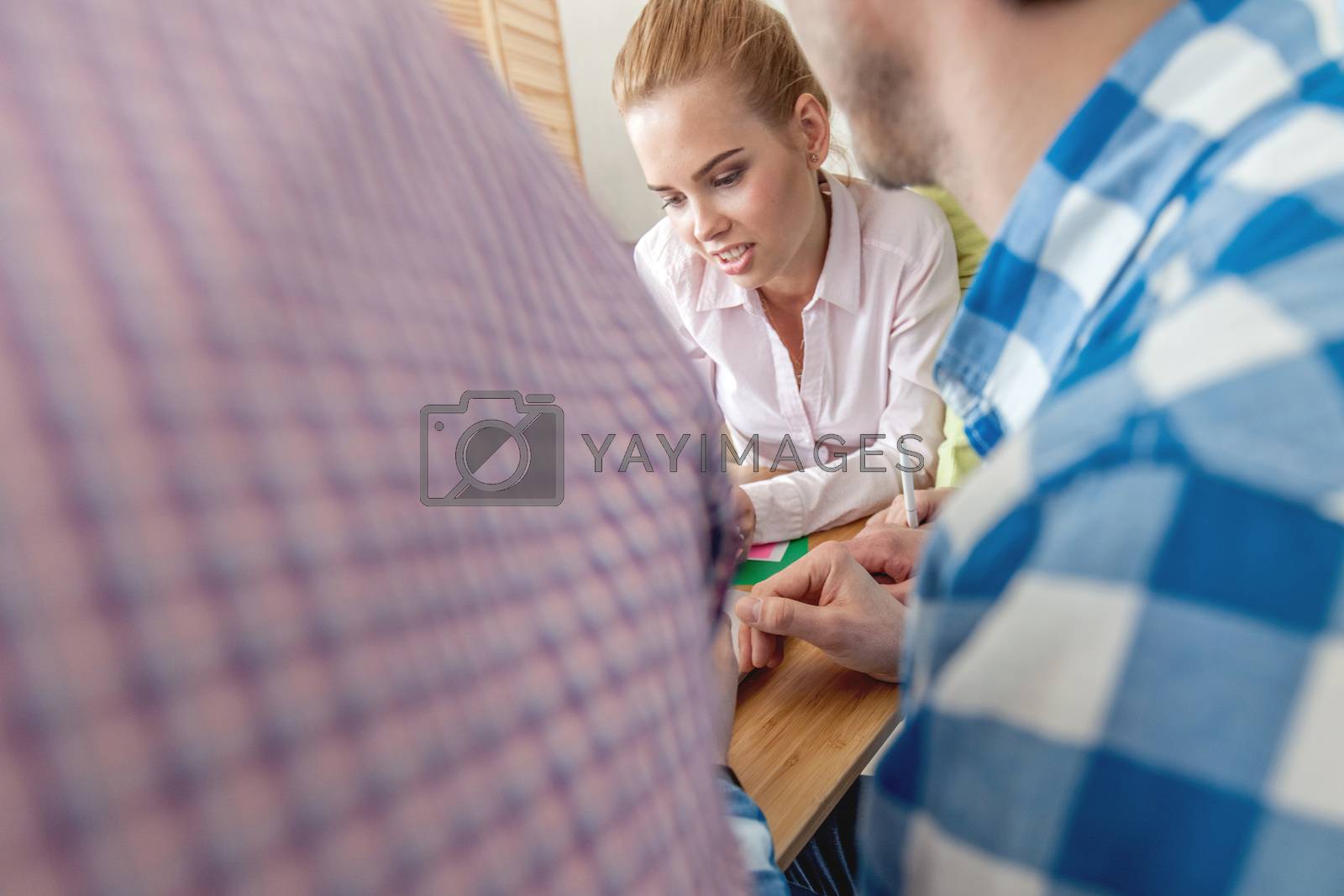Royalty free image of People discussing papers by ALotOfPeople