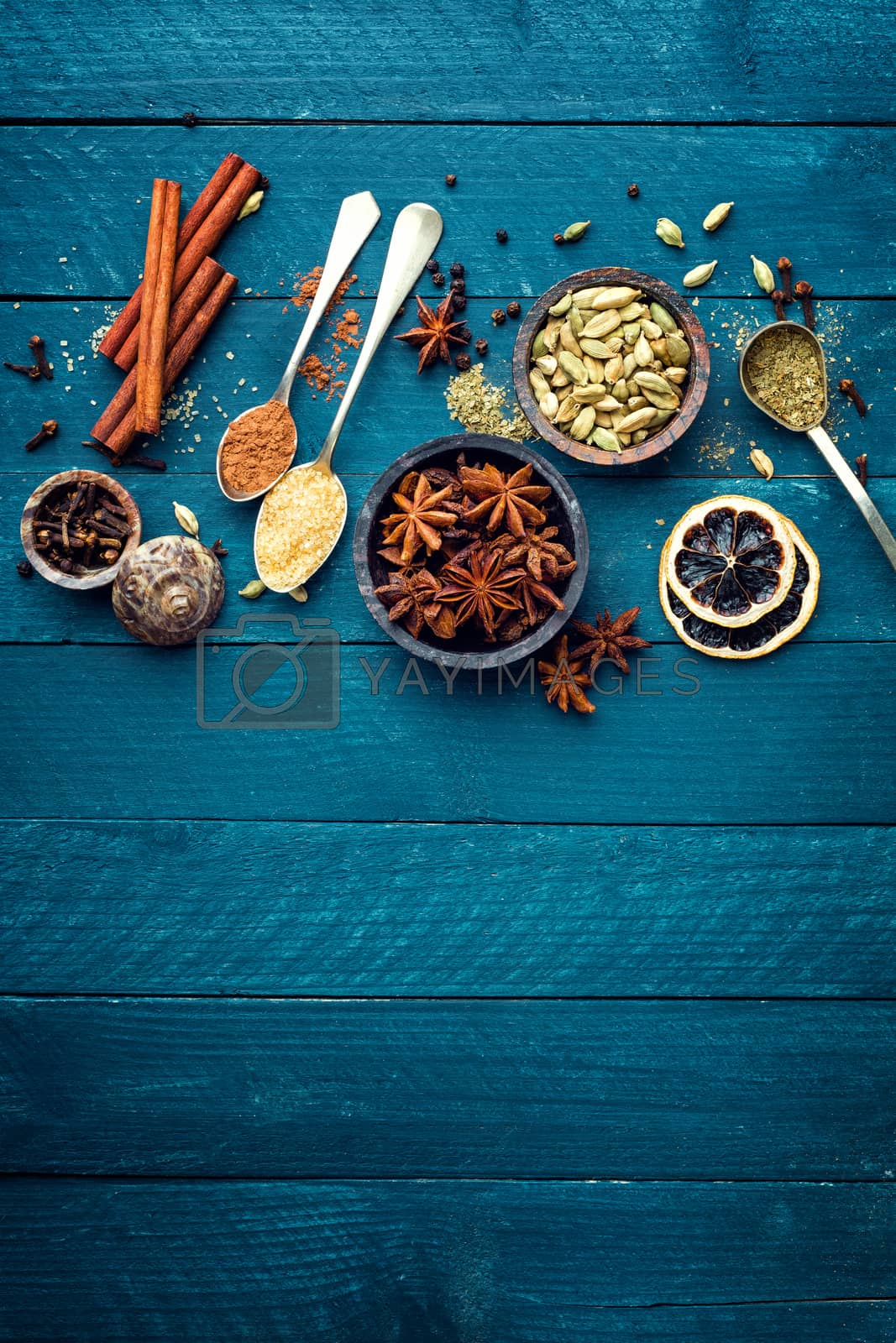 Royalty free image of culinary background with various spices for Christmas mulled wine by yelenayemchuk