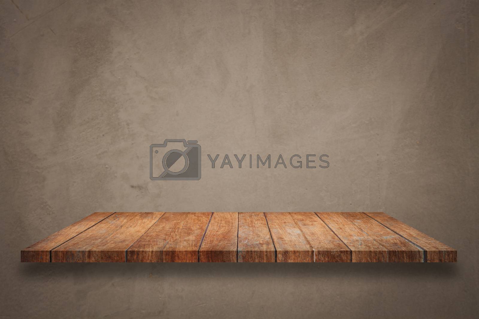 Royalty free image of Top of wooden shelf on concrete background by punsayaporn