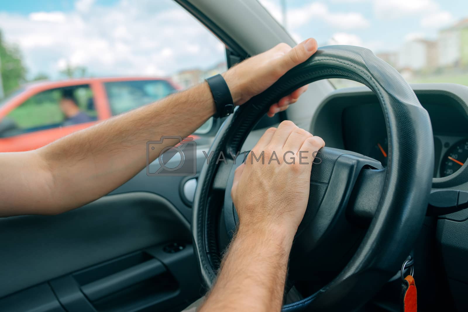 Royalty free image of Nervous male driver pushing car horn in traffic rush hour by stevanovicigor