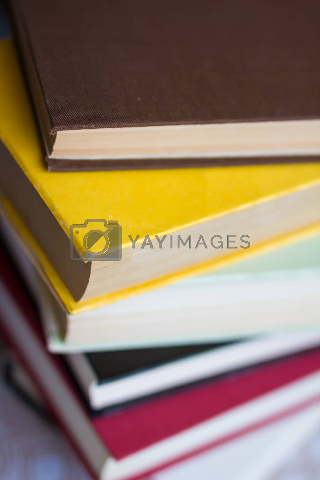 Royalty free image of Closeup of stacked old books and textbook by maggee