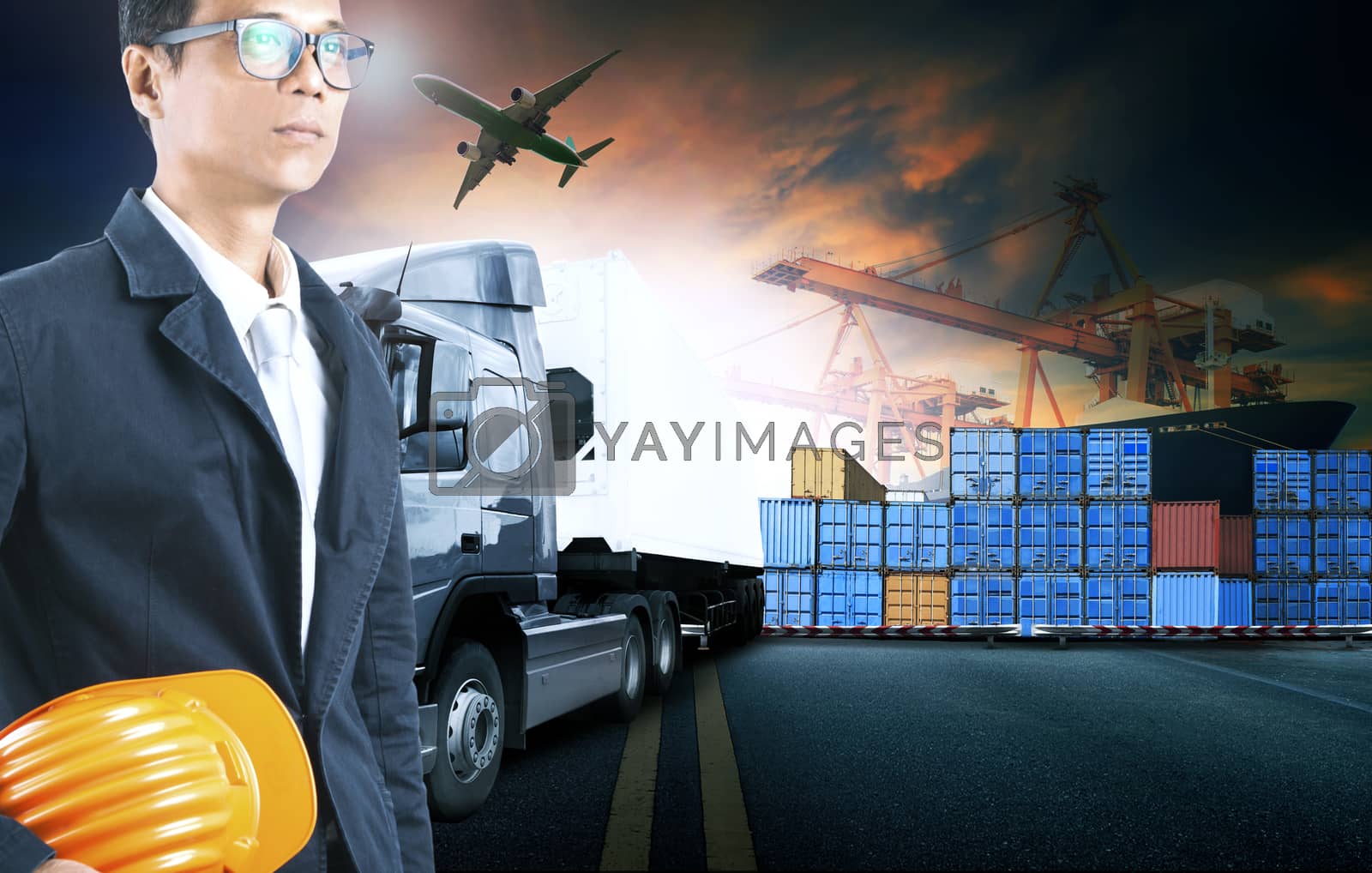 Royalty free image of business man working in shipping port use for logistic and cargo by khunaspix