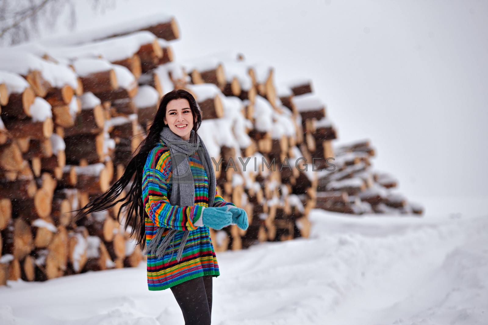Royalty free image of Beautiful young woman walking in winter outdoors by weise_maxim