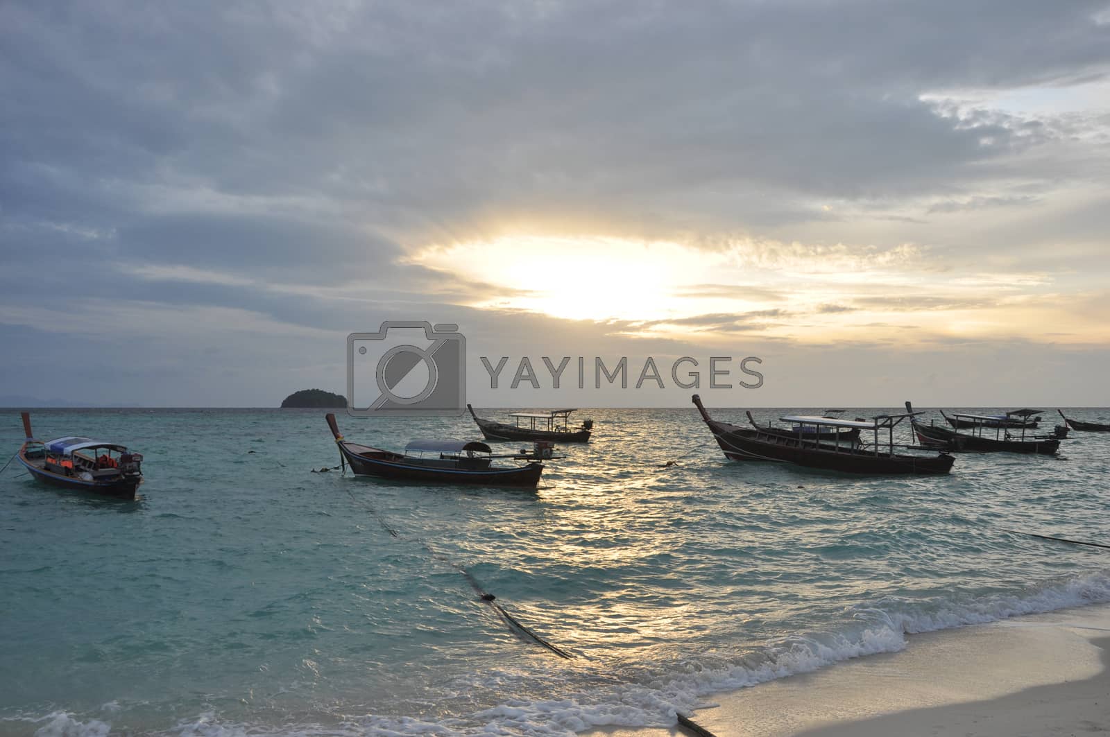 Royalty free image of Boat in the sea with sunrise background by ngarare