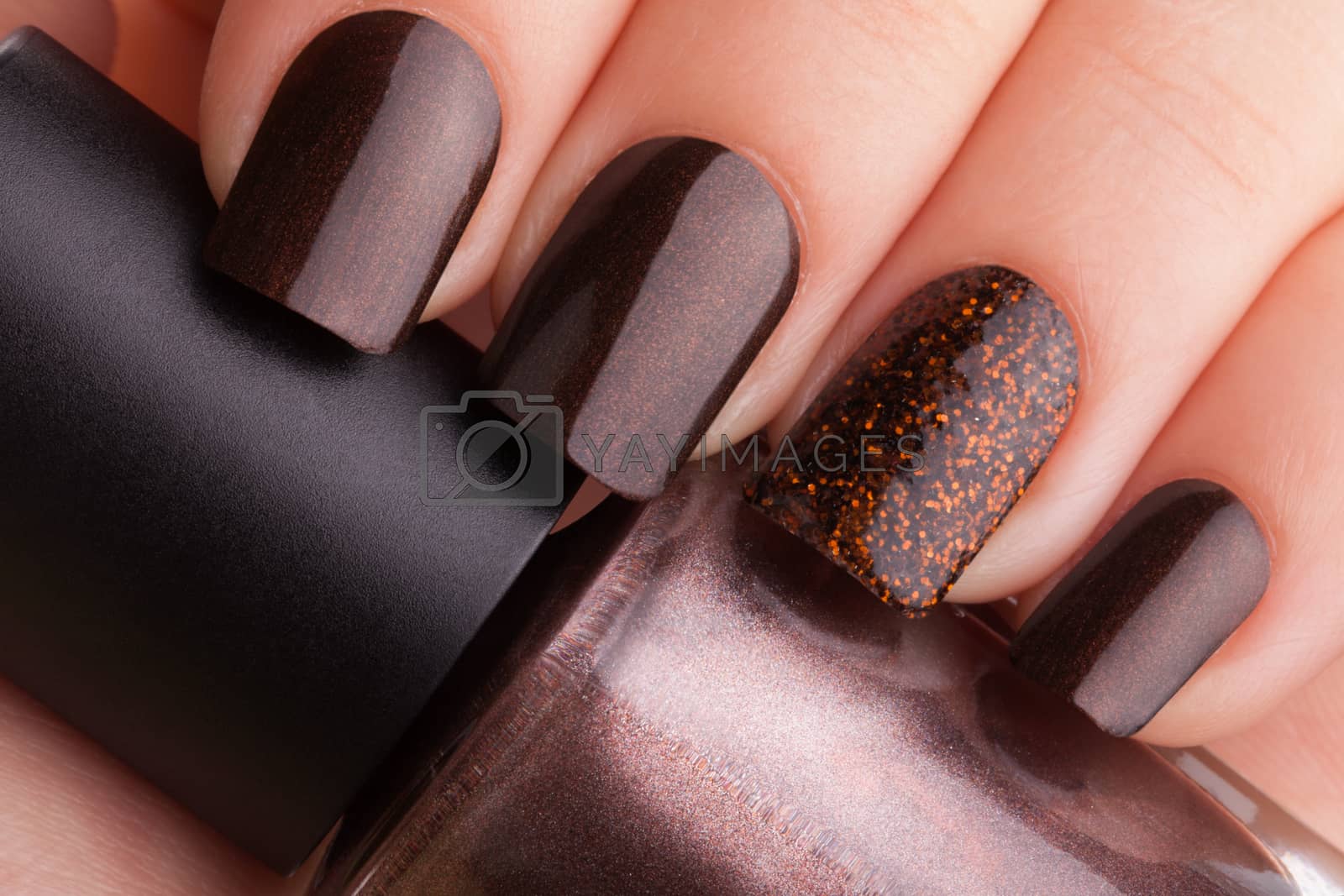 Royalty free image of Brown nails . by SergeyTay