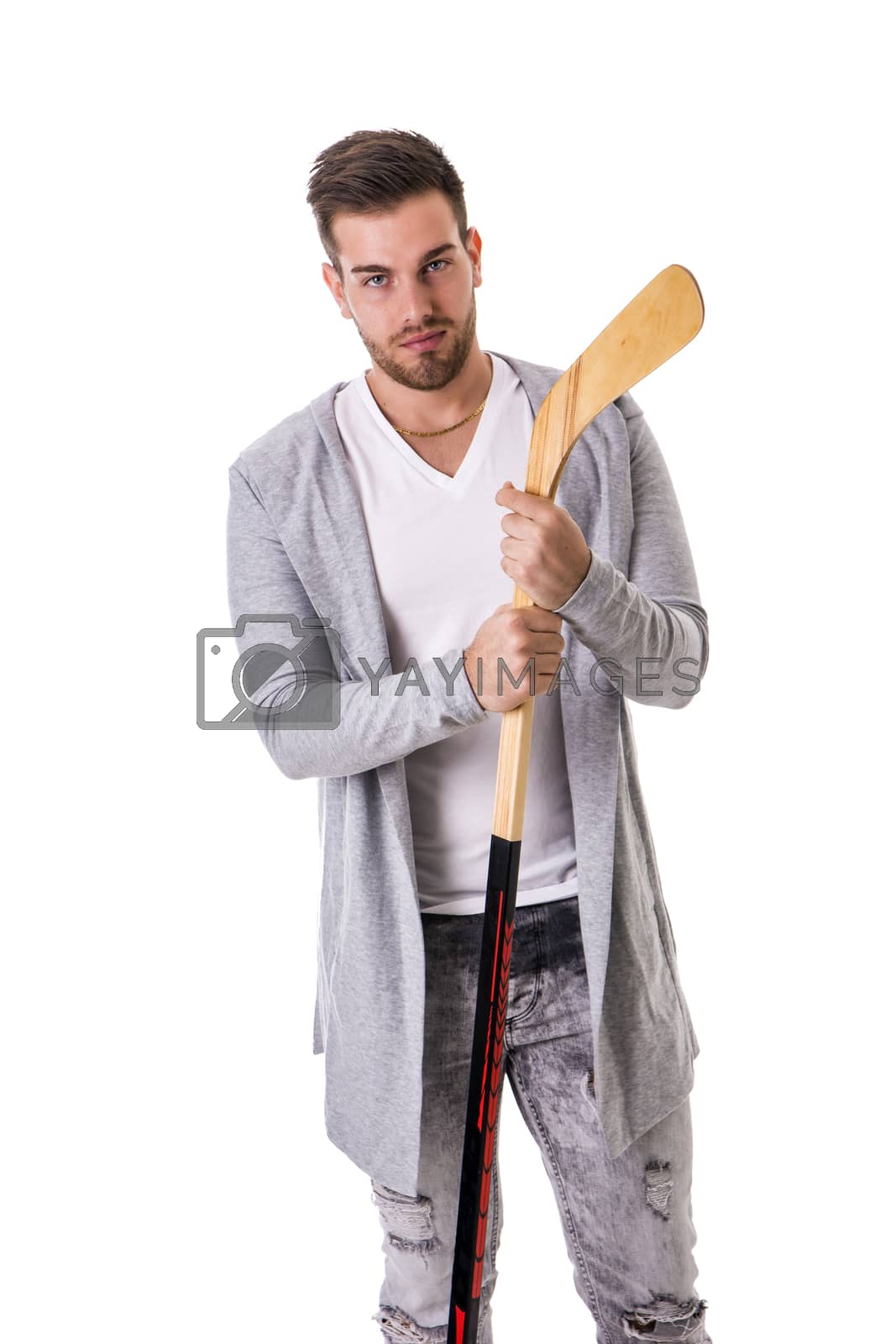 Royalty free image of Handsome man with a hockey stick by artofphoto