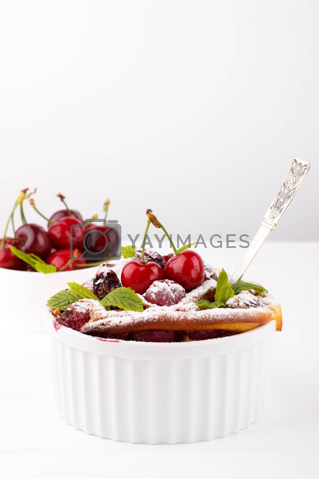 Royalty free image of French clafoutis with cherry by Lana_M