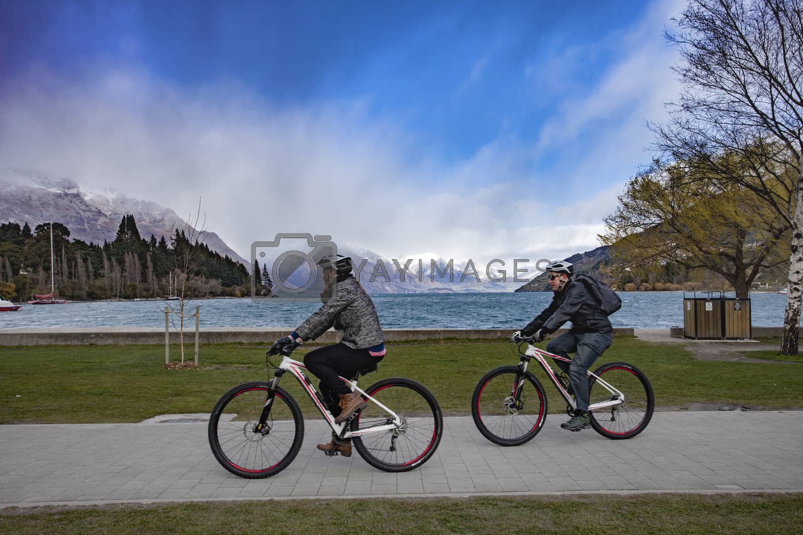 Royalty free image of QUEENSTOWN NEW ZEALAND - SEPTEMBER 6 :  tourist riding bicycle a by khunaspix