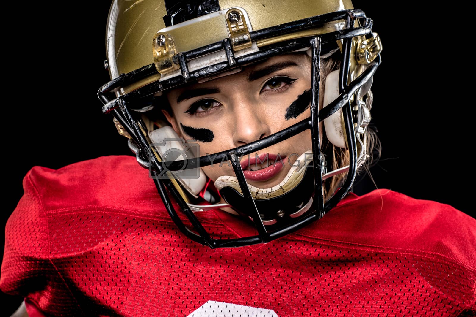 Royalty free image of American football player in helmet by LightFieldStudios