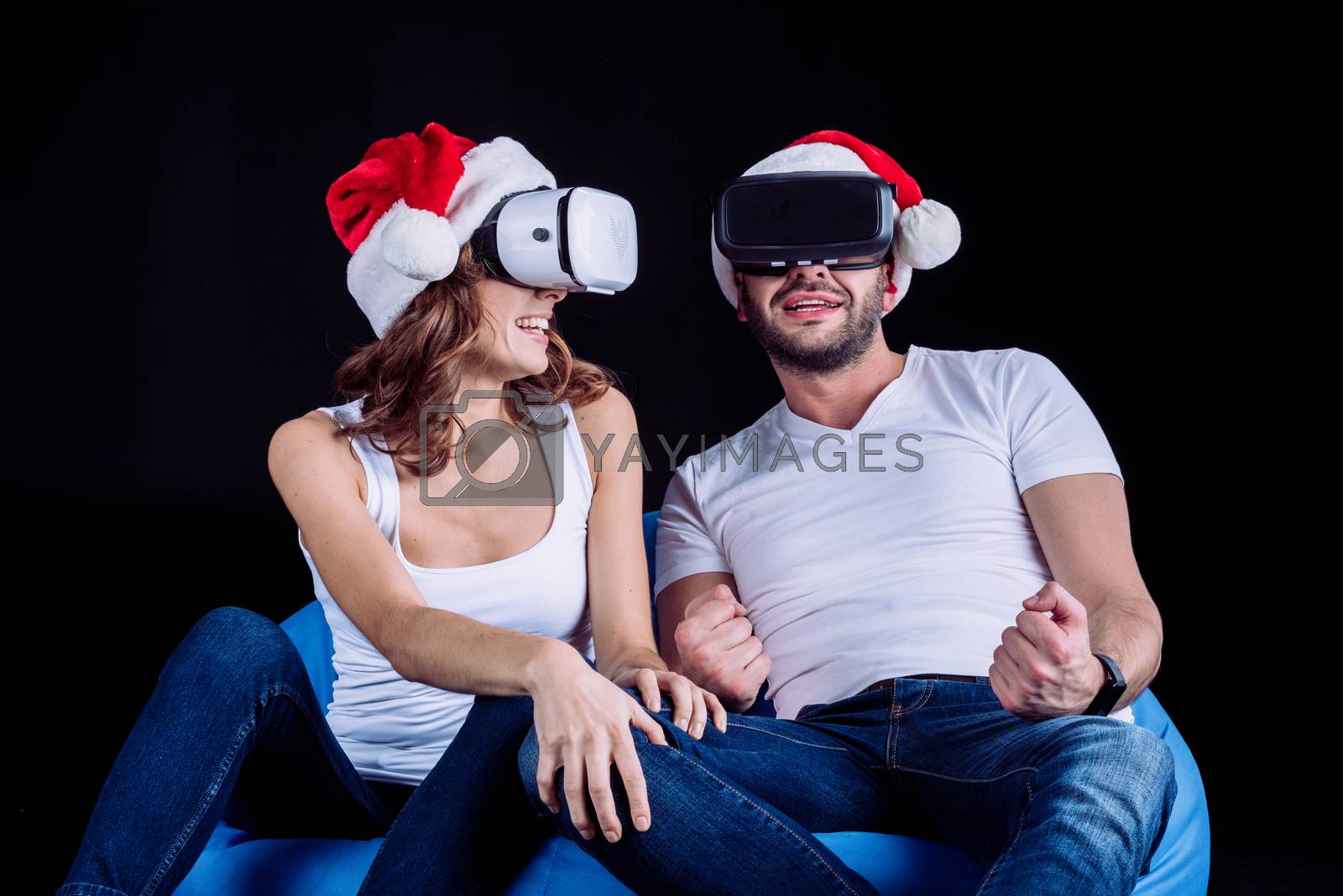 Royalty free image of couple using virtual reality headsets by LightFieldStudios
