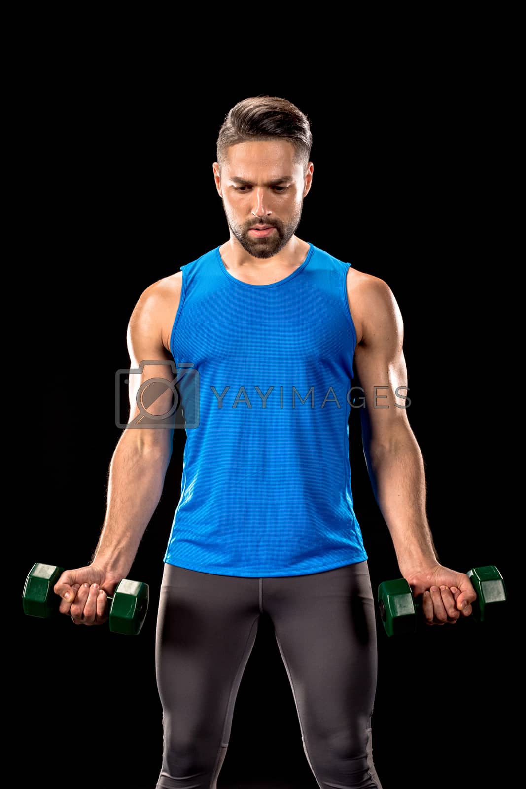 Royalty free image of Sportive man with dumbbells by LightFieldStudios