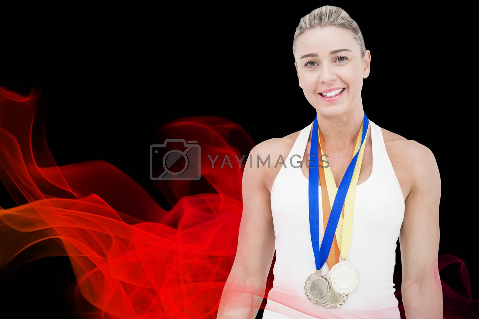 Royalty free image of Composite image of female athlete wearing medals by Wavebreakmedia