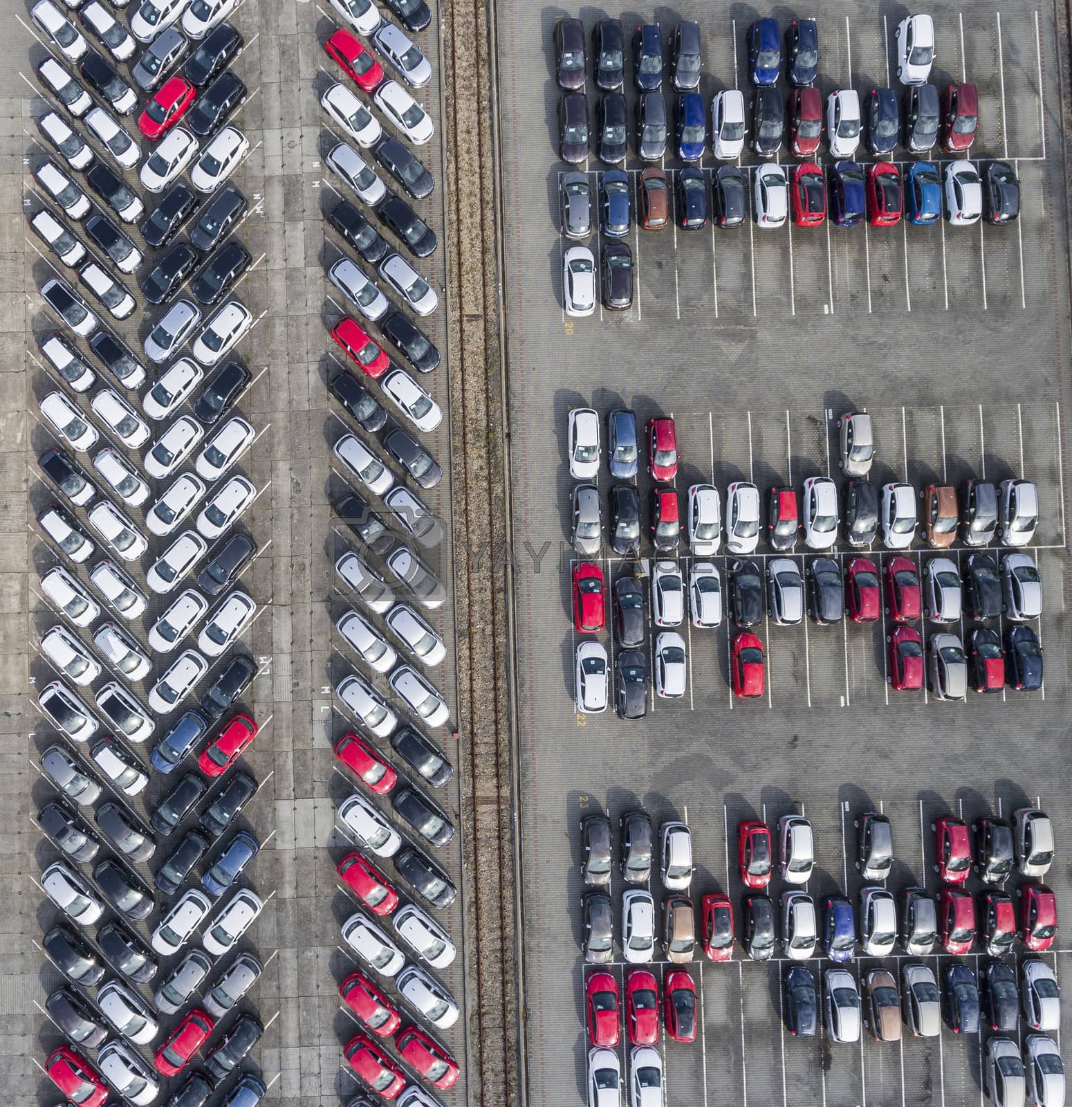 Royalty free image of Aerial view lot of vehicles on parking for new car. by mariusz_prusaczyk