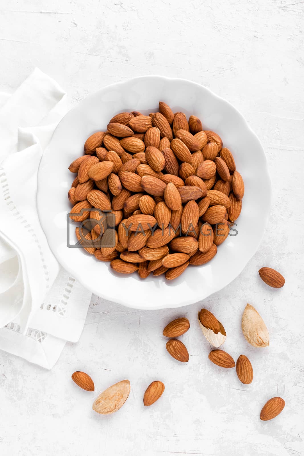 Royalty free image of Almond nuts on white background directly above flat lay by yelenayemchuk