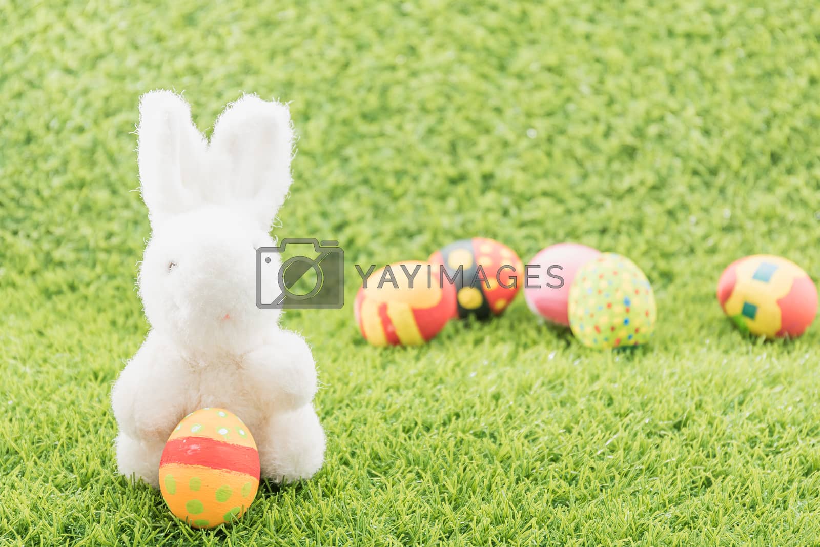 Royalty free image of Easter bunny toy and Easter eggs by stoonn