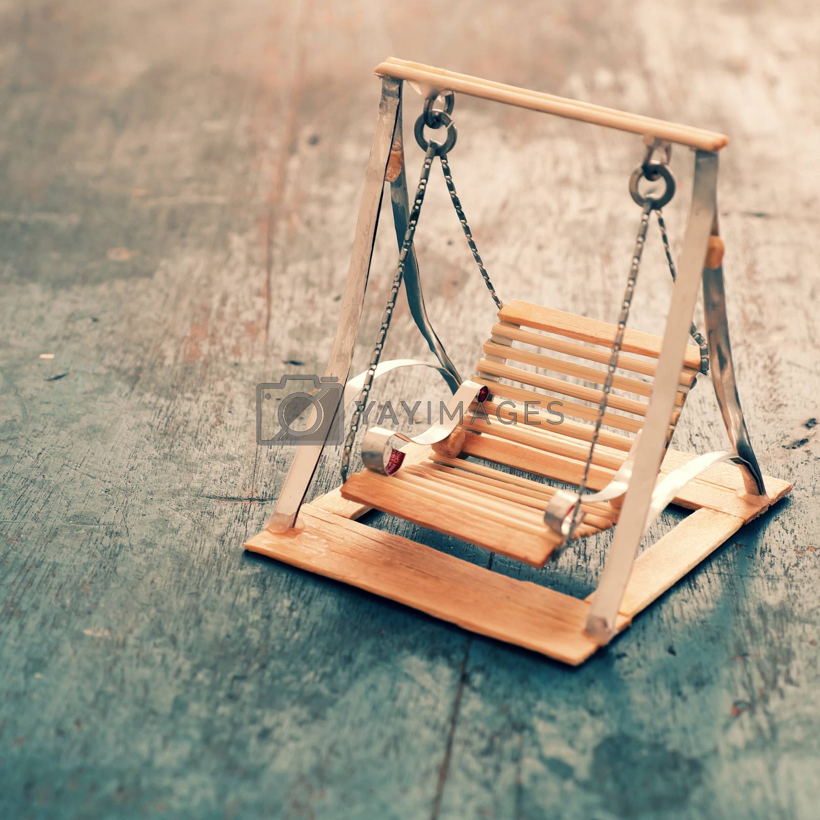 Royalty free image of  mini furniture, cute small swing by xuanhuongho