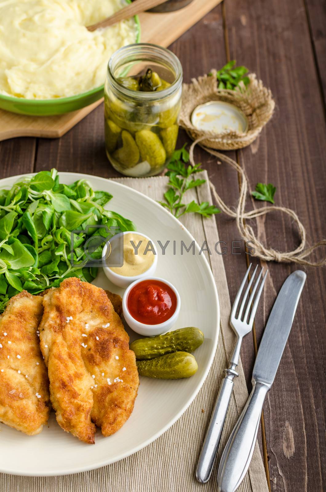 Royalty free image of Schnitzel with mashed potatoes and salad by Peteer