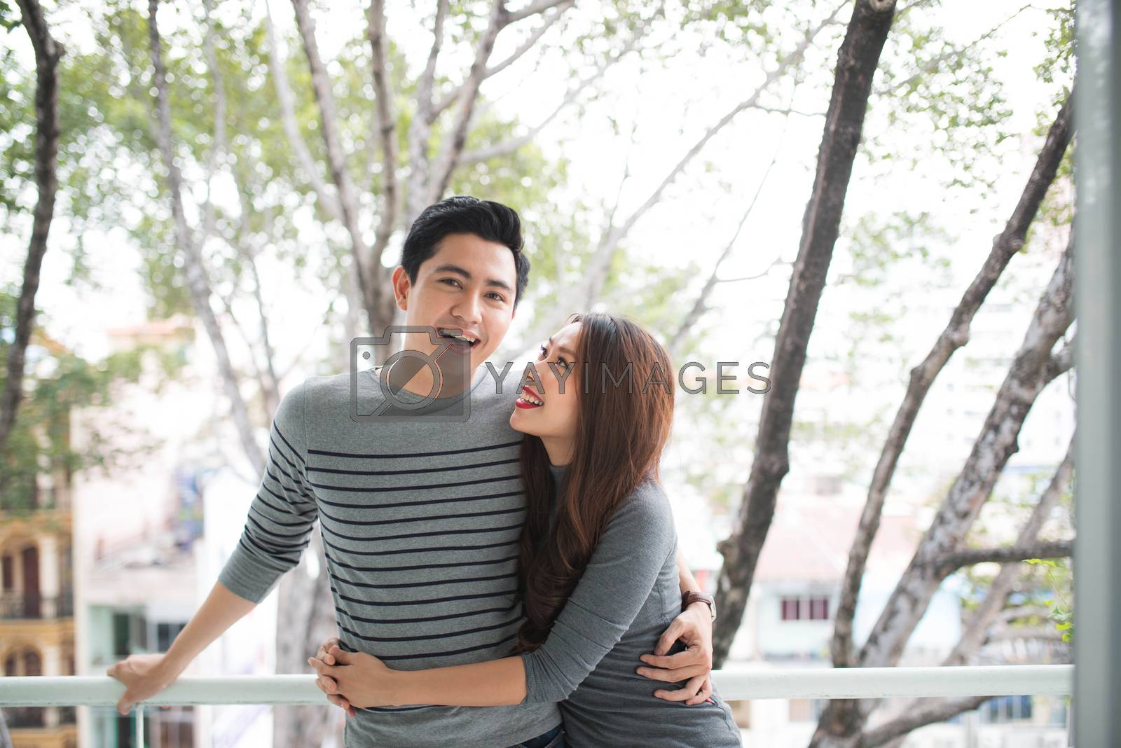 Royalty free image of Couple in love sharing genuine emotions and happiness, hugging o by makidotvn