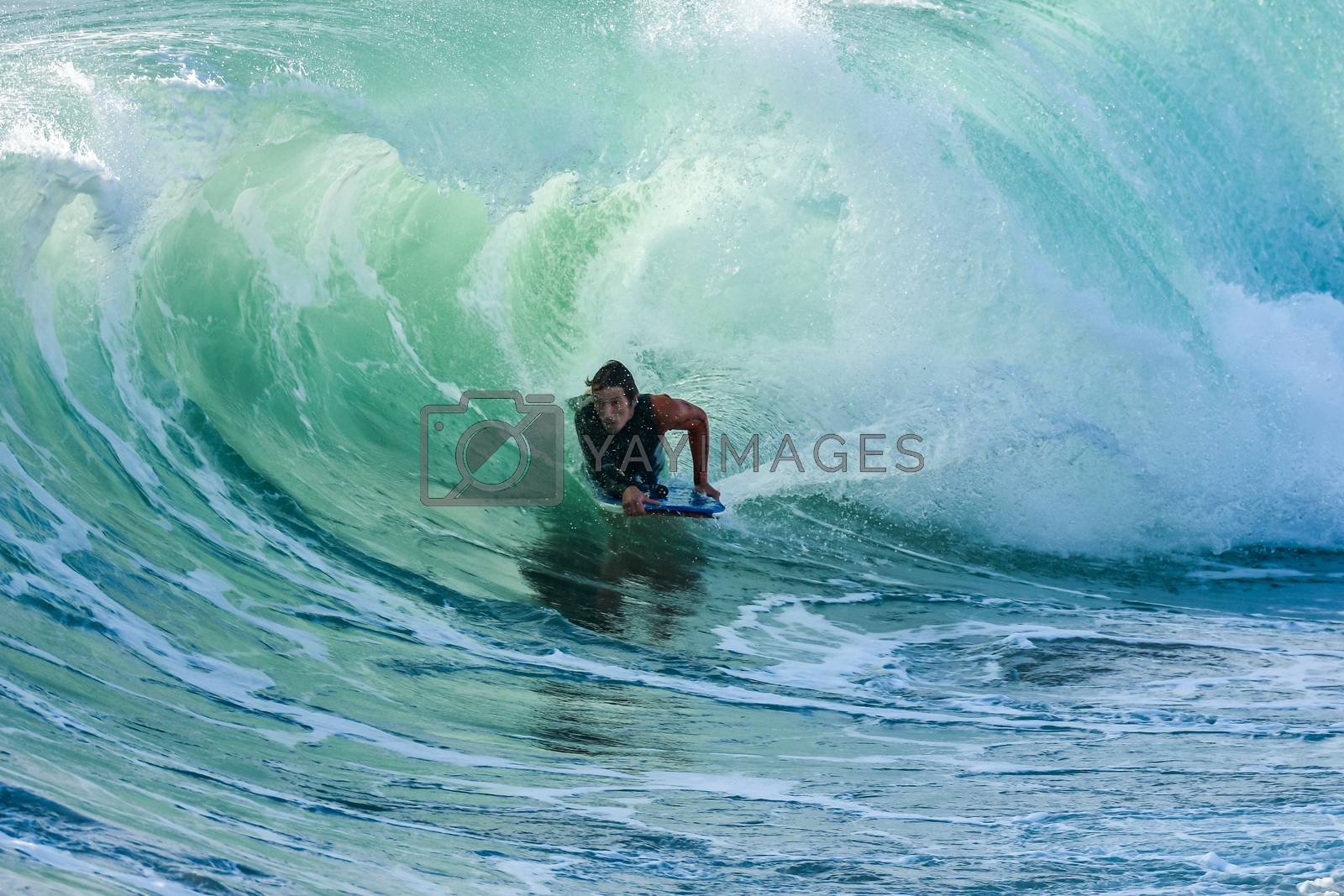 Royalty free image of Bodyboarder in action by homydesign