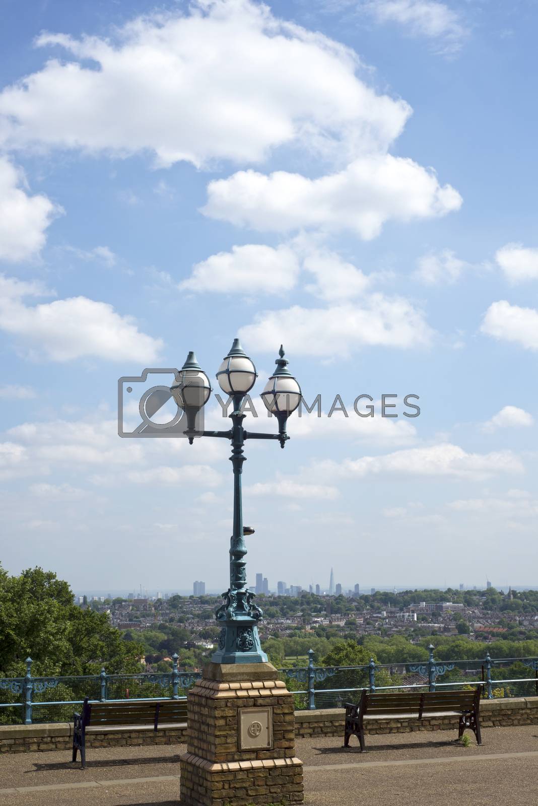 Royalty free image of antique street light with london city by morrbyte