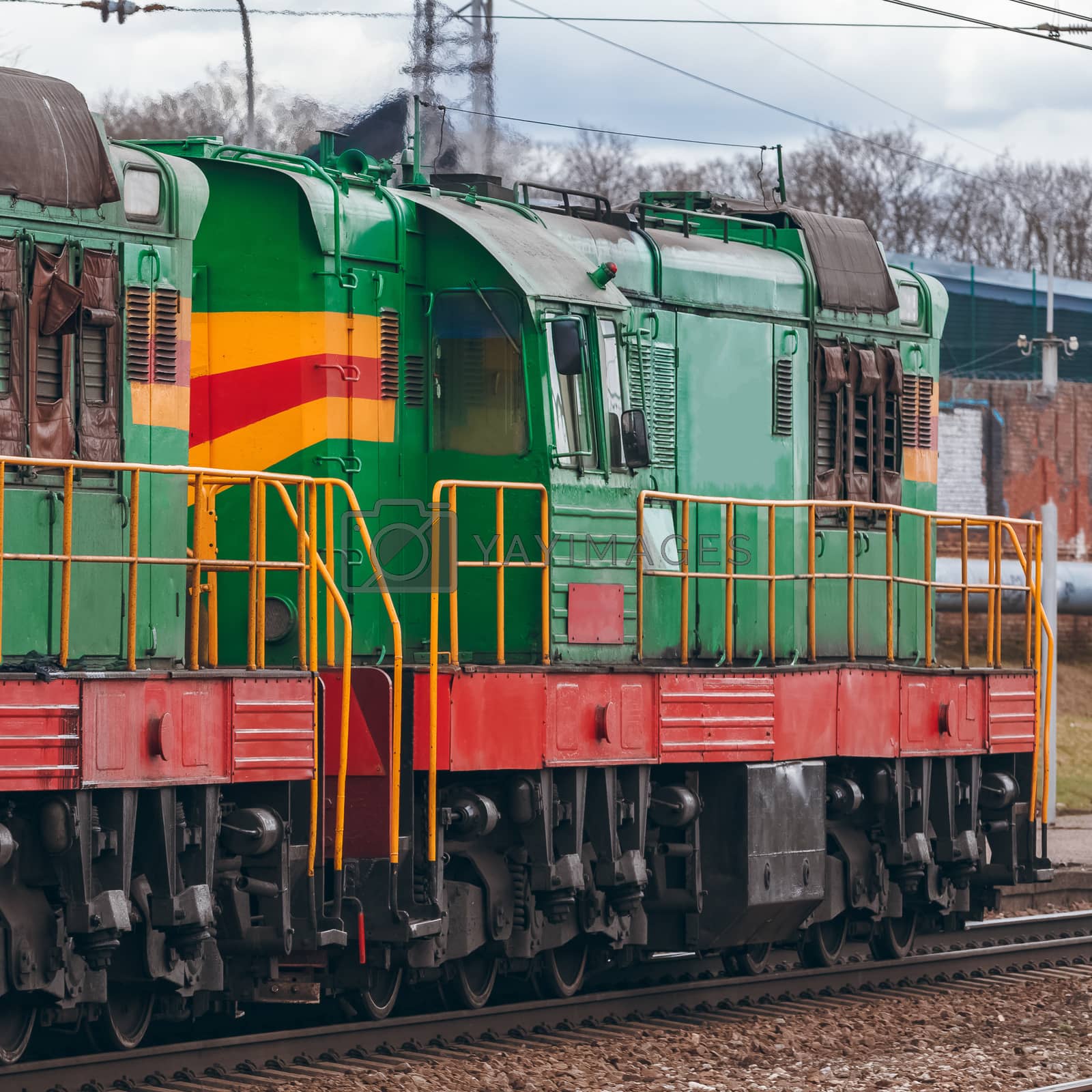 Royalty free image of Green diesel locomotive by sengnsp