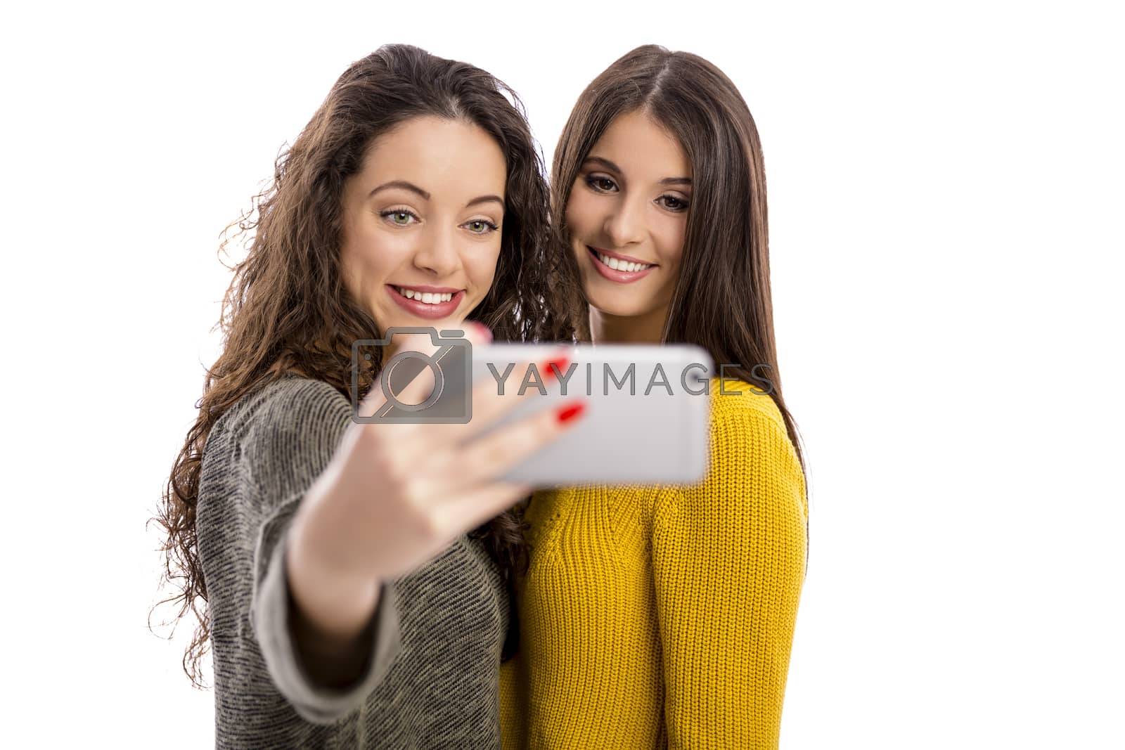 Royalty free image of Girls taking selfie by Iko
