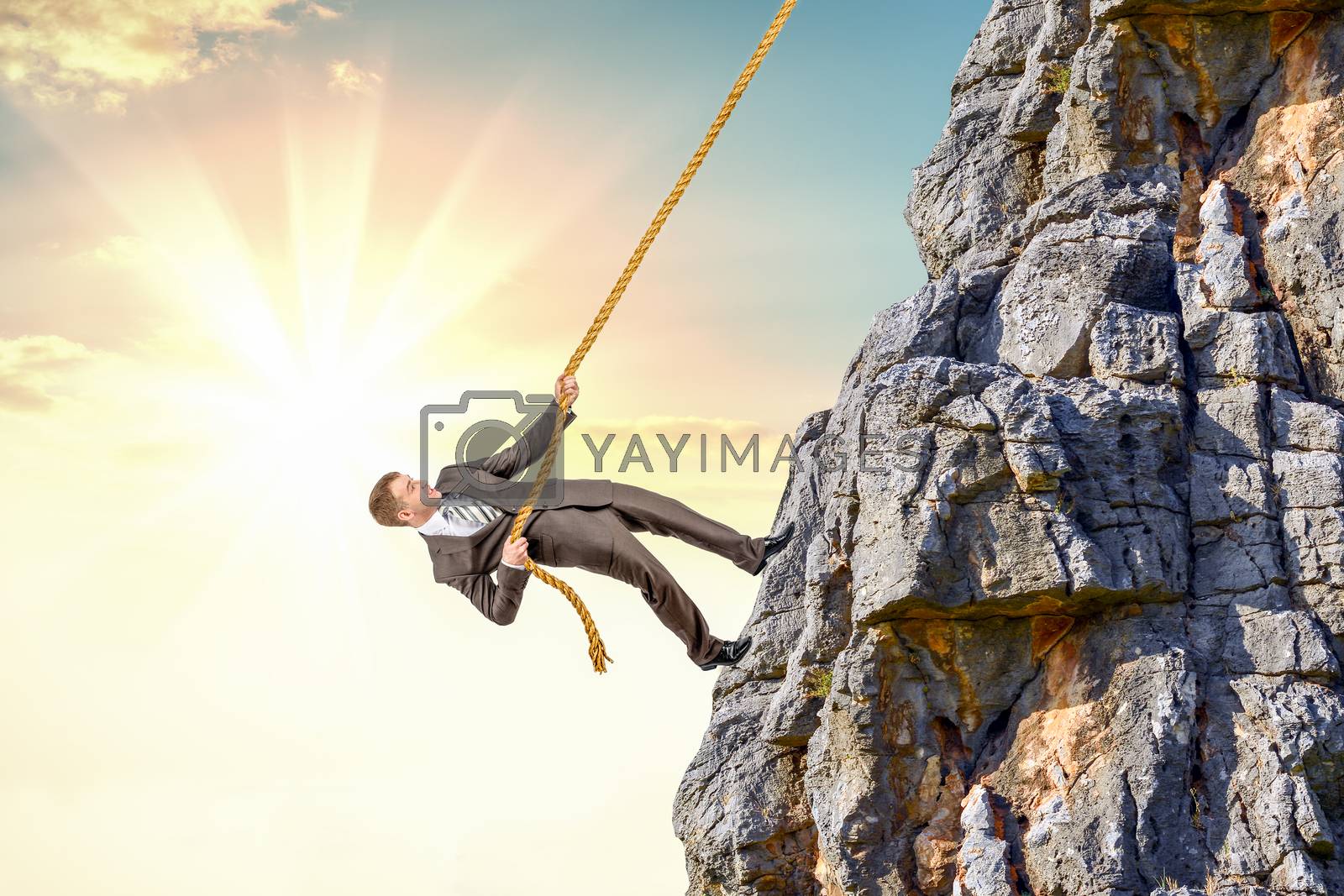 Royalty free image of Businessman climb a mountain by cherezoff