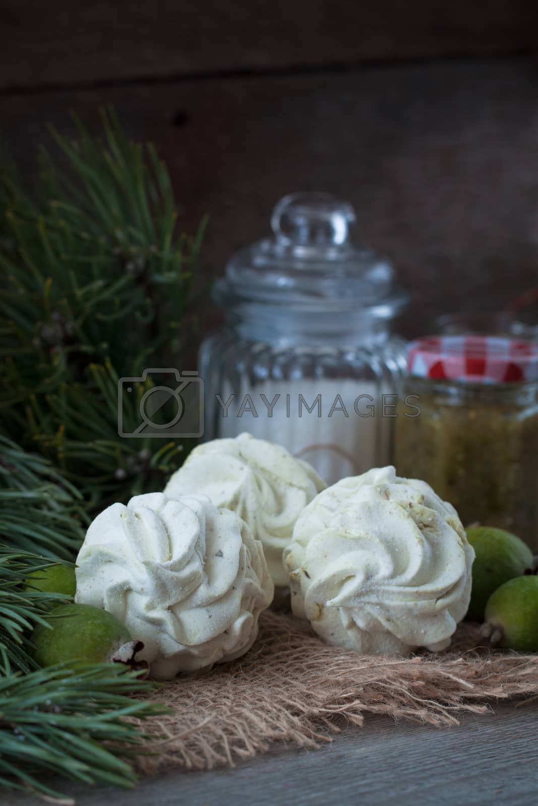 Royalty free image of Winter feijoa tasted zephyr or marsmallows on the wooden background by Katia1504