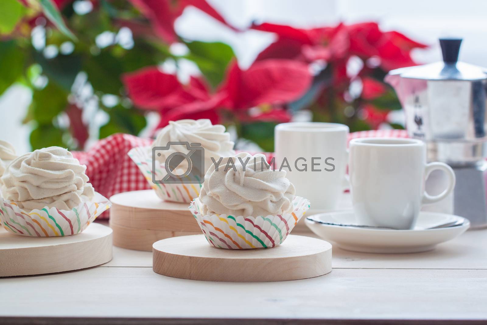 Royalty free image of Breakfast with marshmallow or zephyr with a cup of coffee near Christmas poinsettia by Katia1504