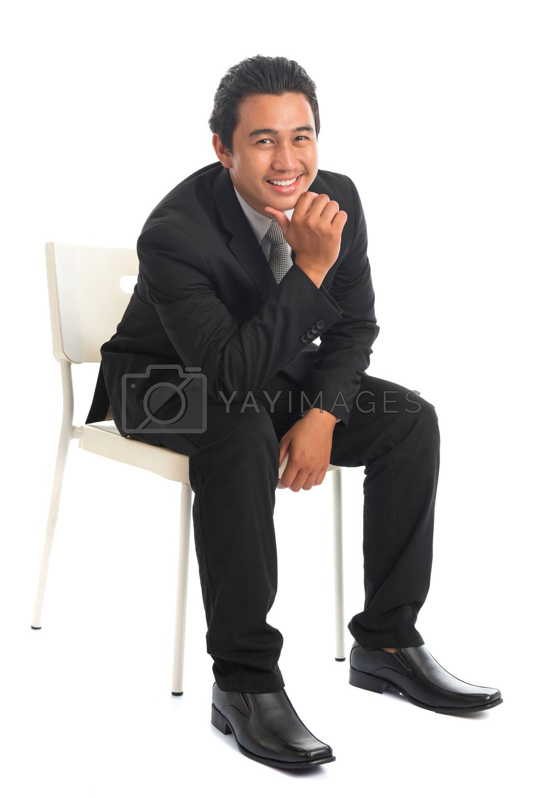 Royalty free image of Southeast Asian businessman sitting by szefei