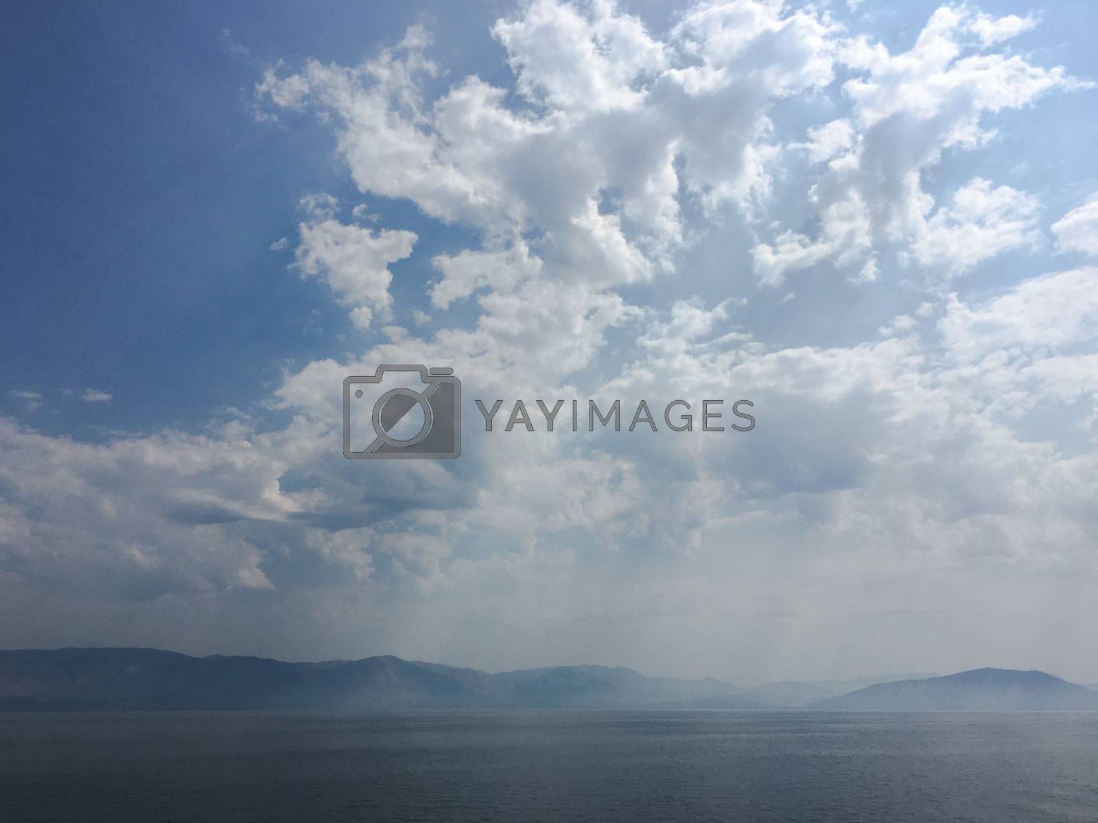 Royalty free image of beautiful blue sky with clouds background.Sky with clouds weather nature cloud blue.Blue sky with clouds and sun. by titco