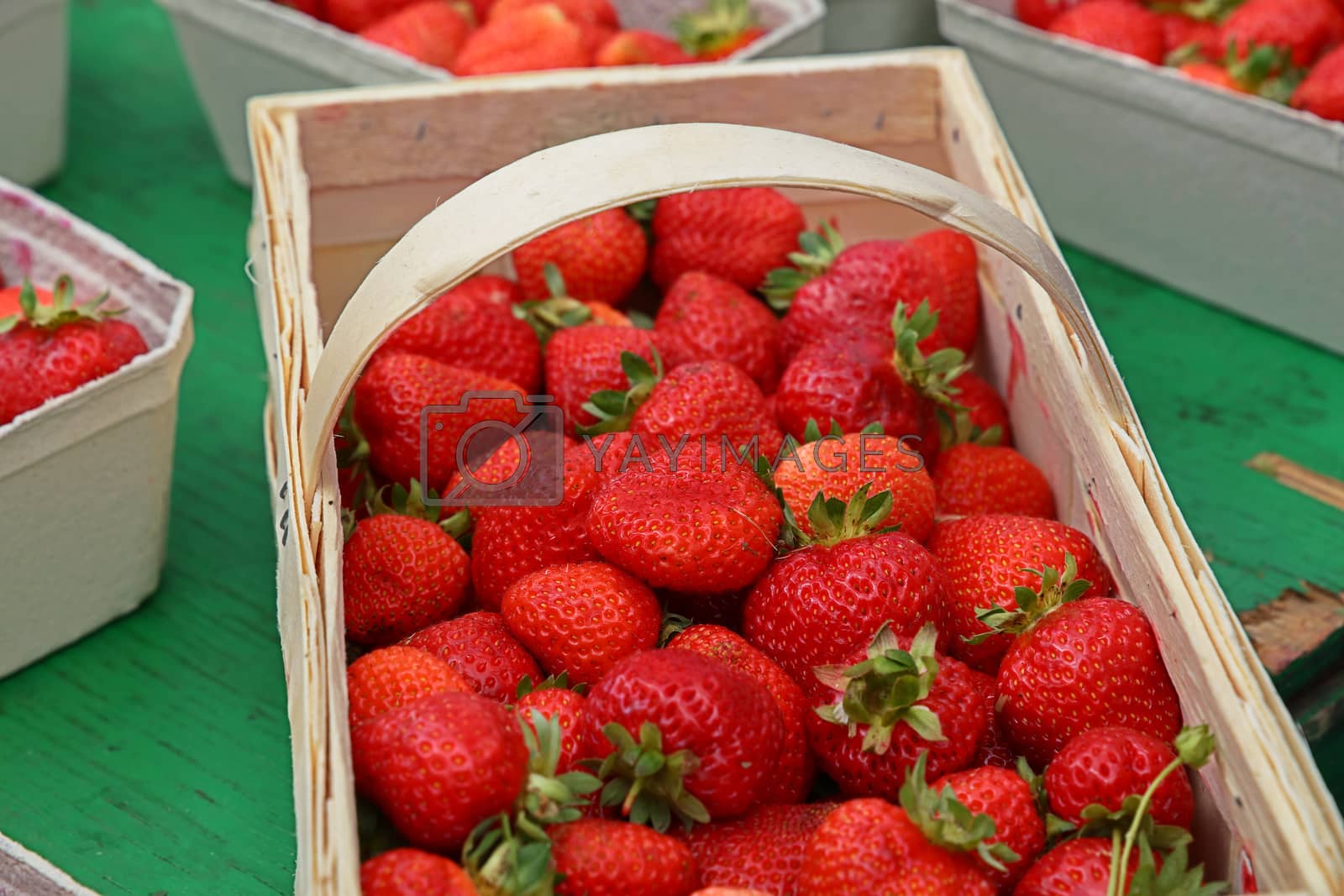 Royalty free image of Close up strawberry in wooden crate on market by BreakingTheWalls