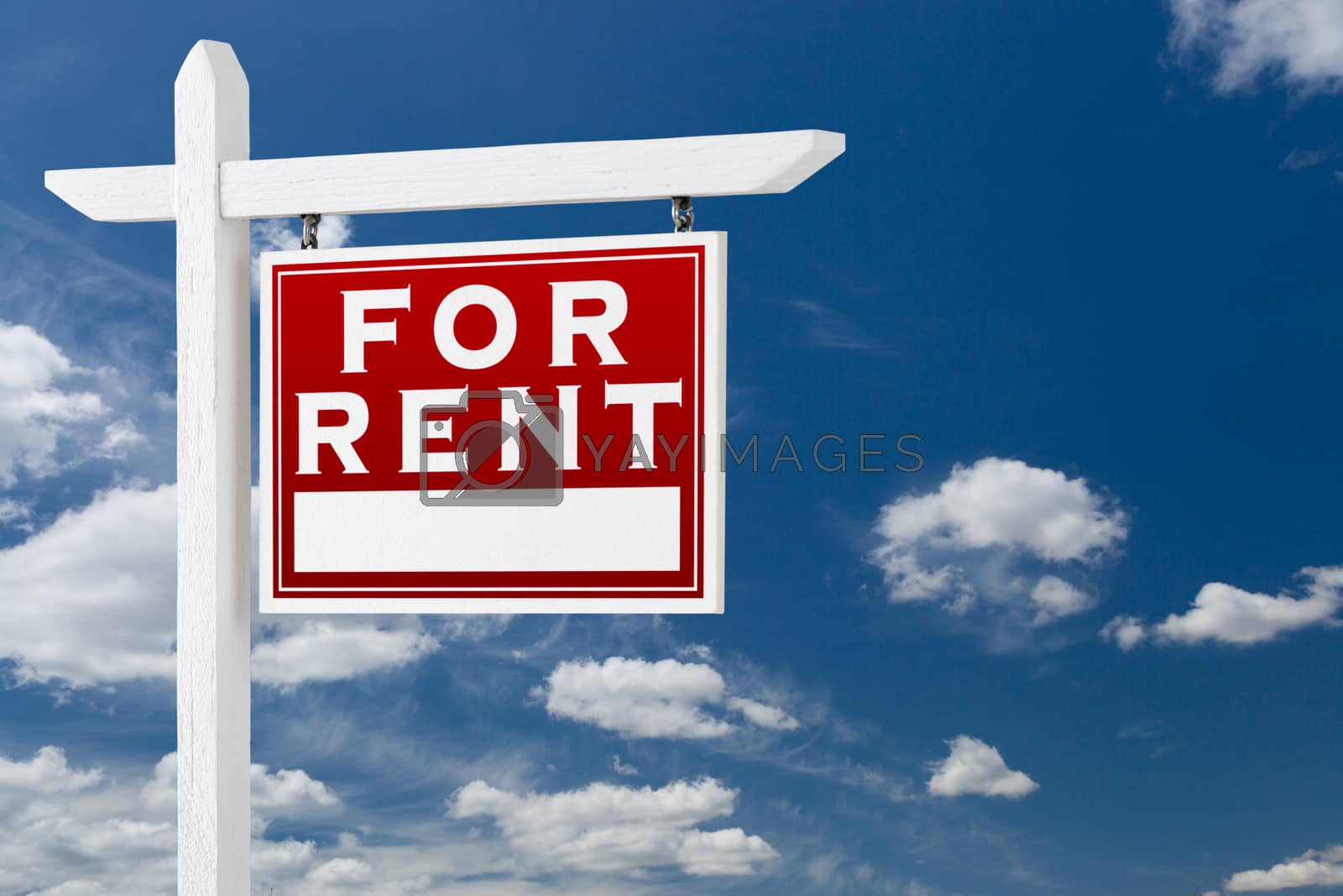 Royalty free image of Right Facing For Rent Real Estate Sign Over Blue Sky and Clouds  by Feverpitched