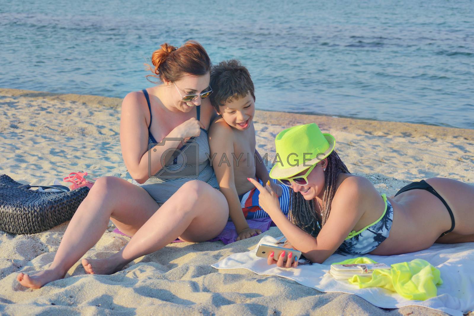 Royalty free image of Three Group Beach Selfie Kid by vilevi