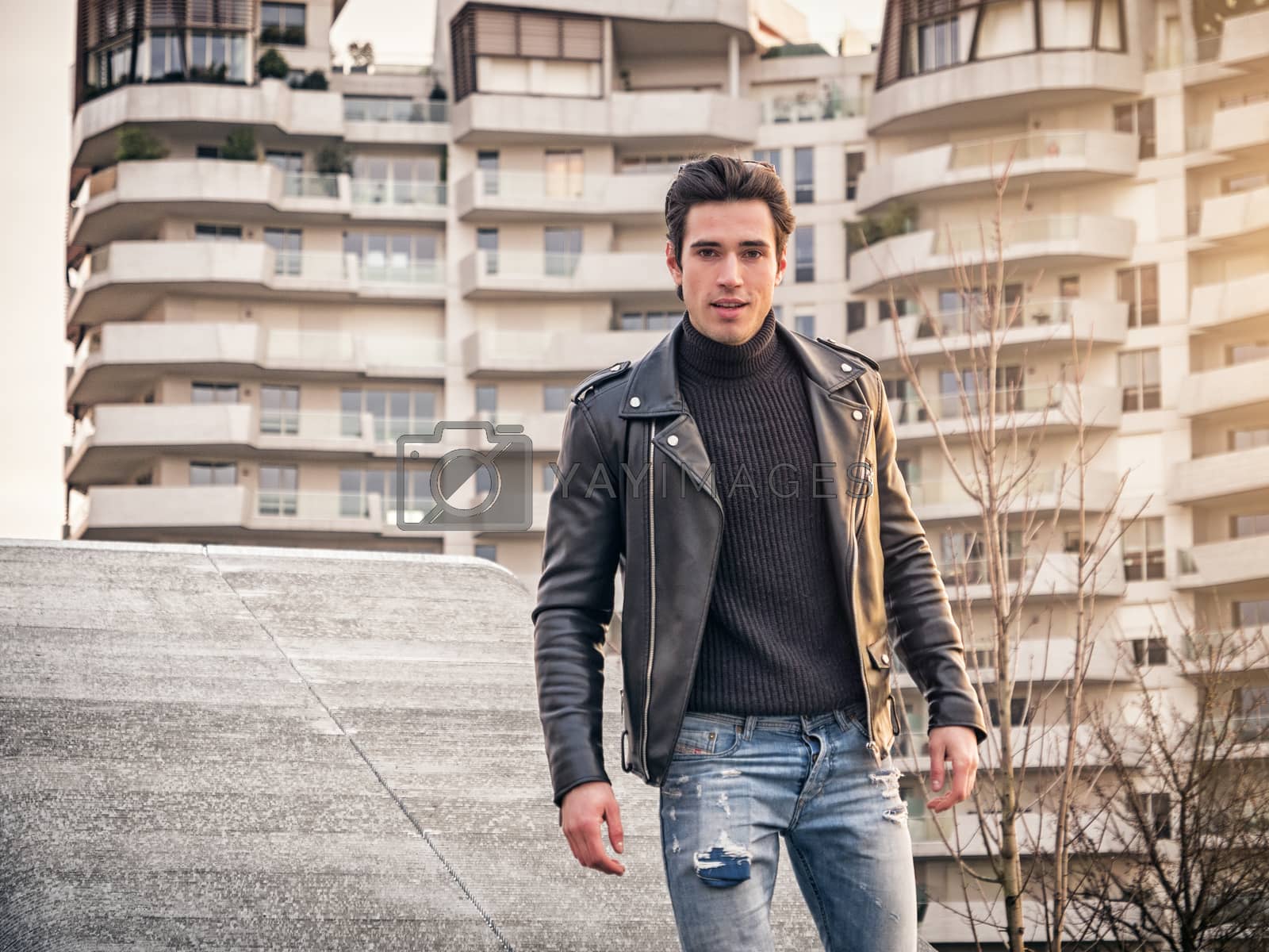 Royalty free image of One handsome young man in modern city setting by artofphoto