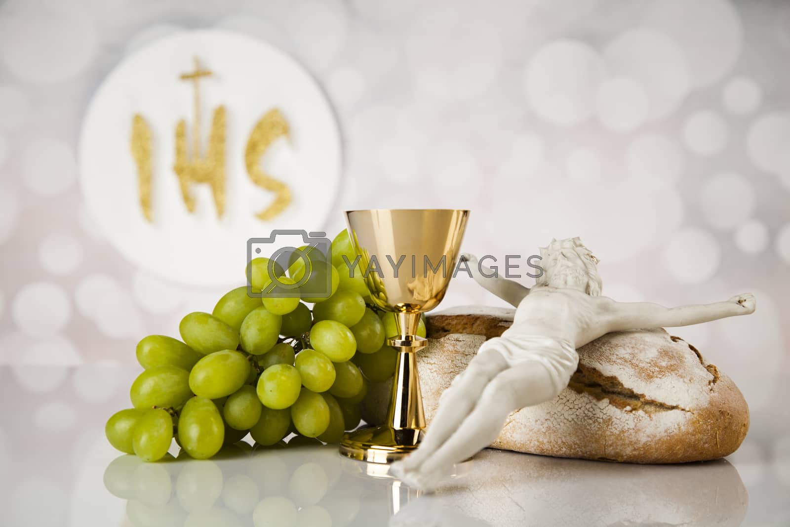 Royalty free image of Holy communion a golden chalice, composition isolated on white by JanPietruszka