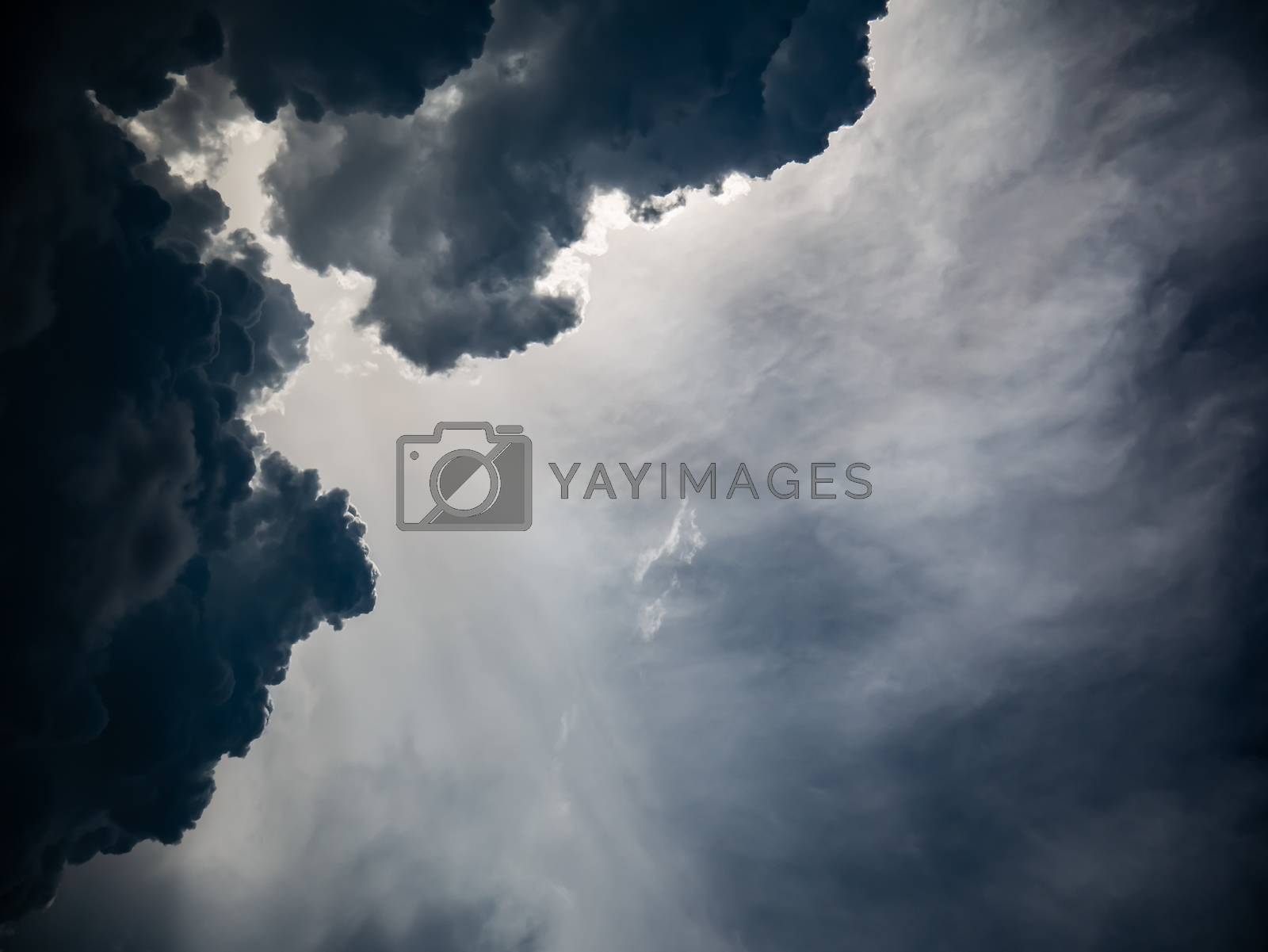 Royalty free image of Overcast sky with sun ray light background by hadkhanong