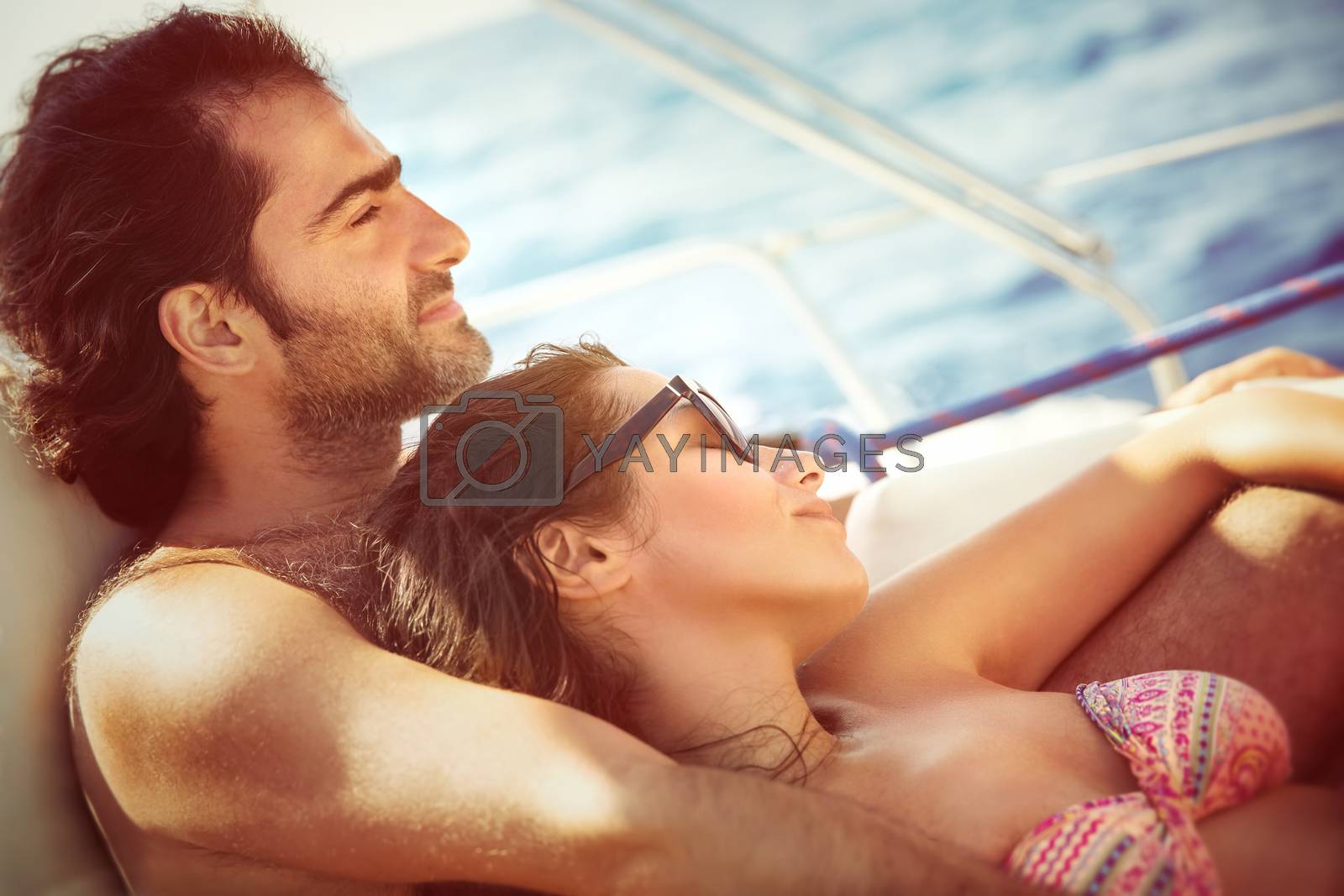 Royalty free image of Couple relaxing on sailboat by Anna_Omelchenko