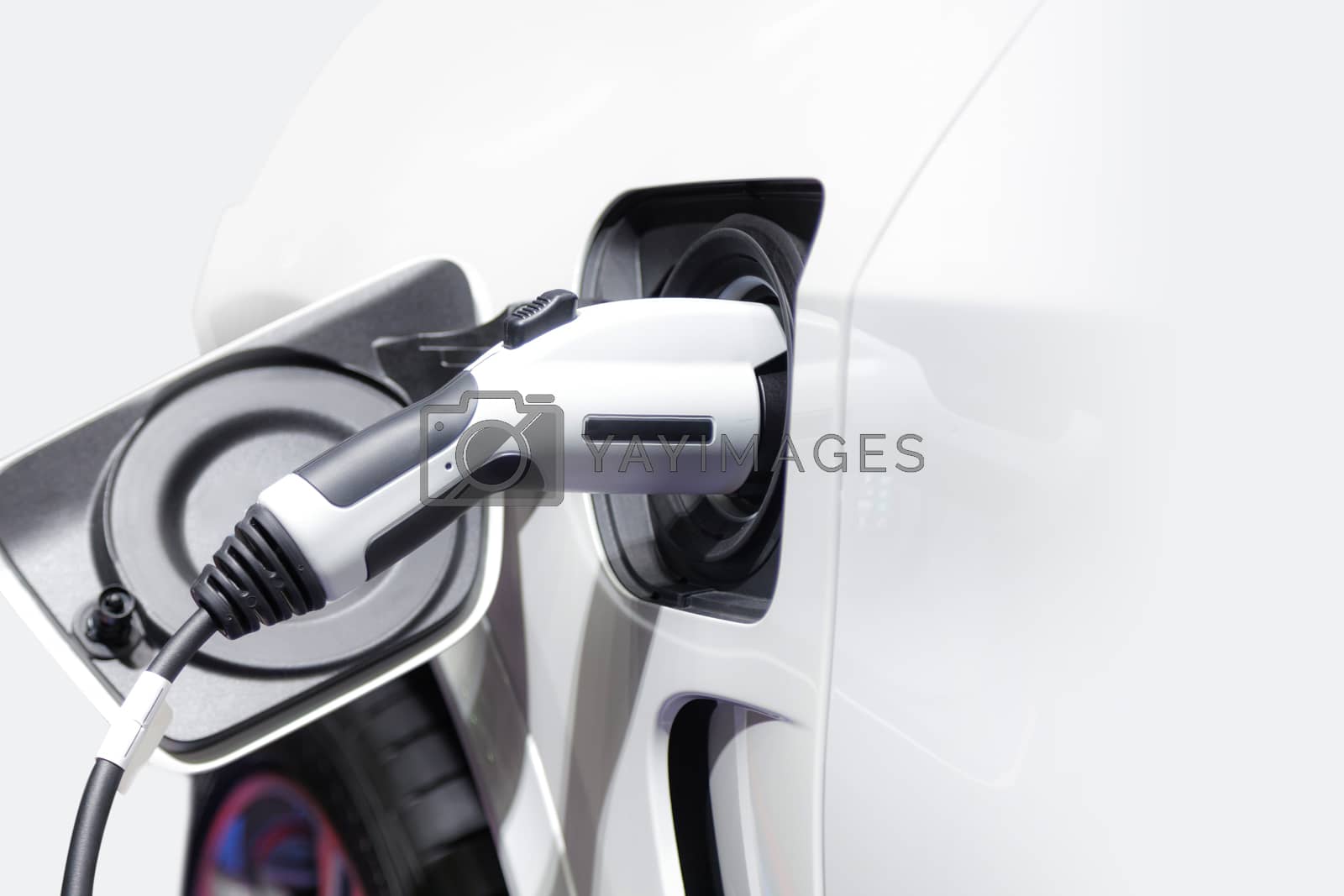 Royalty free image of Charging an electric car, Future of transportation by Naypong