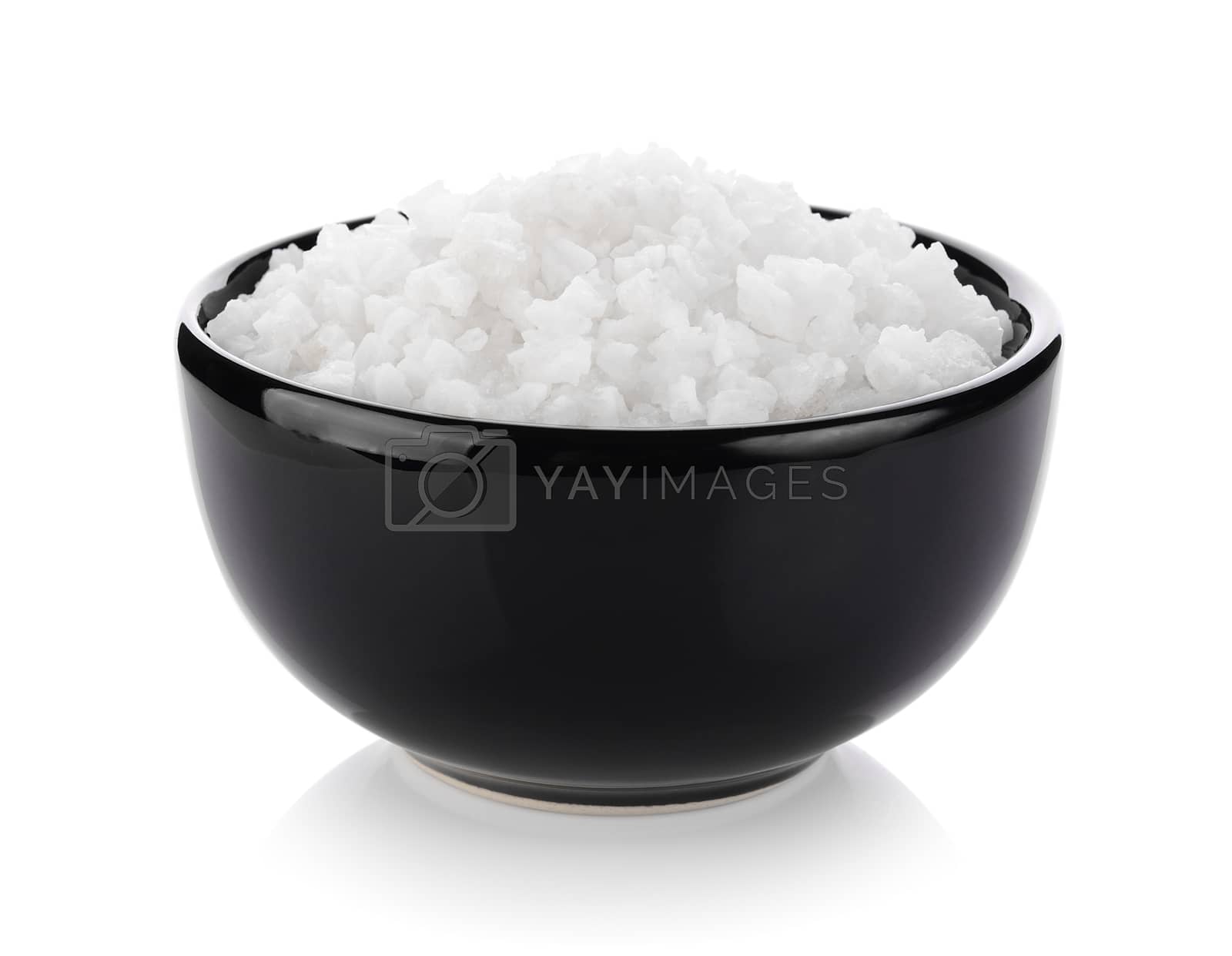 Royalty free image of salt in a bowl on white background by sommai
