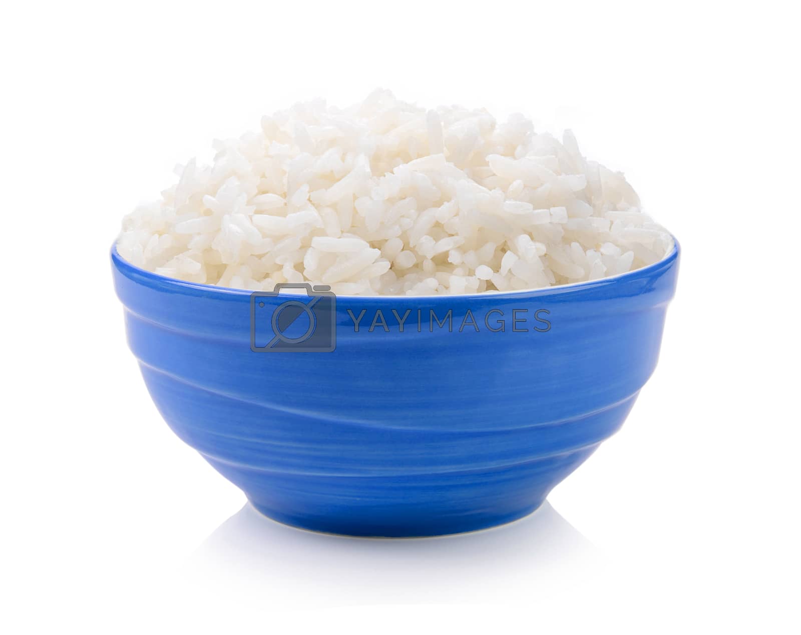 Royalty free image of rice in blue bowl on white background by sommai