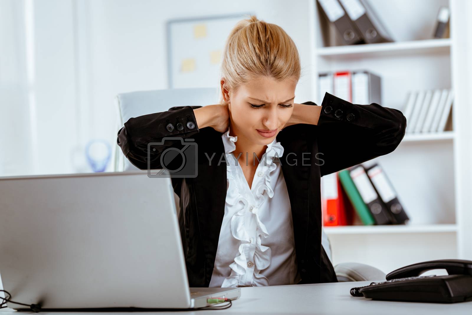 Royalty free image of Tired Businesswoman by MilanMarkovic78