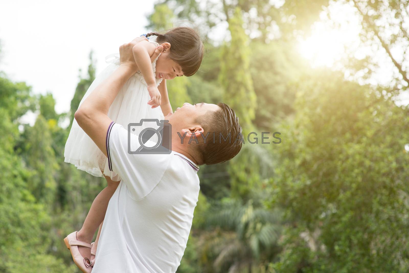 Royalty free image of Happy father and daughter playing outdoors. by szefei