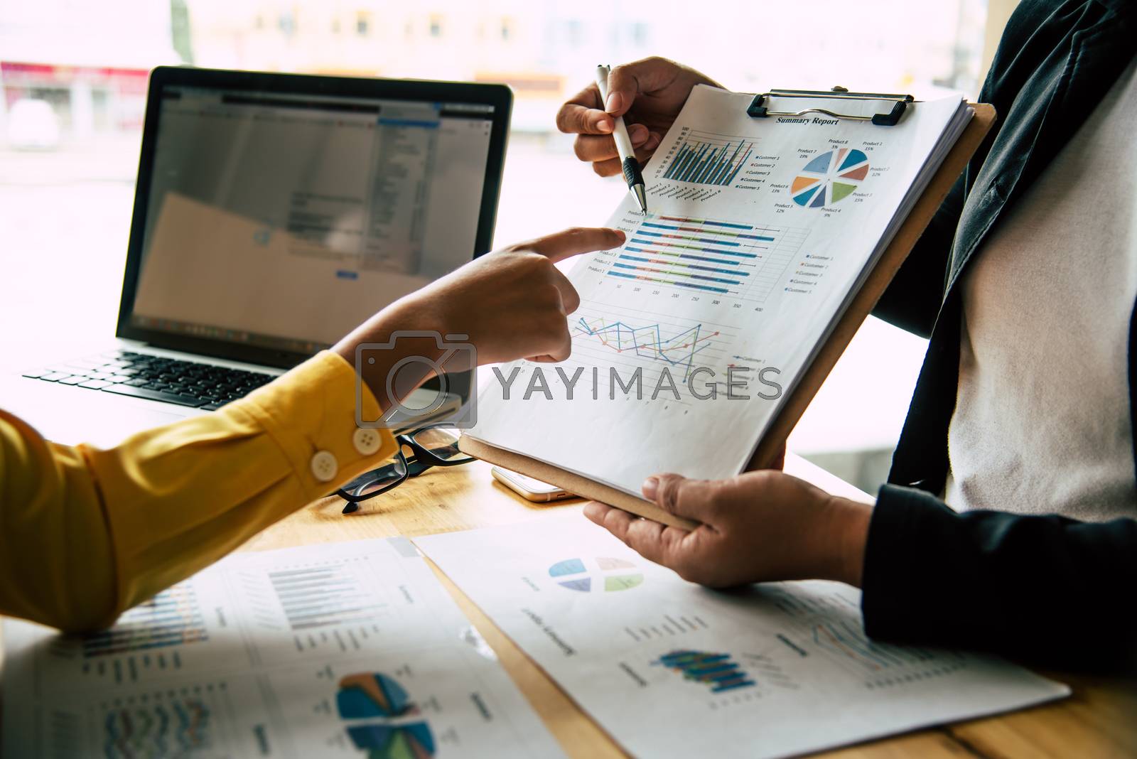 Royalty free image of Business team is working on accounting documents and team work t by photobyphotoboy