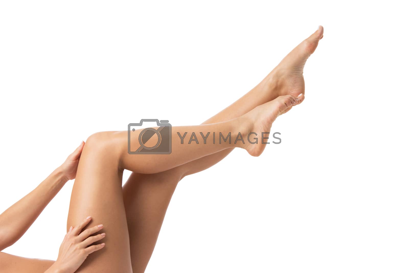 Royalty free image of Young woman touching her legs by Yellowj