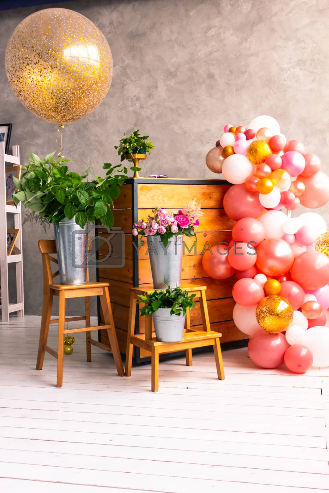 Royalty free image of The workplace of the florist to work. Side view. Making floral decorations. Flowers on a old wooden table. Tools and accessories florists need for making up a bouquet. by rdv27