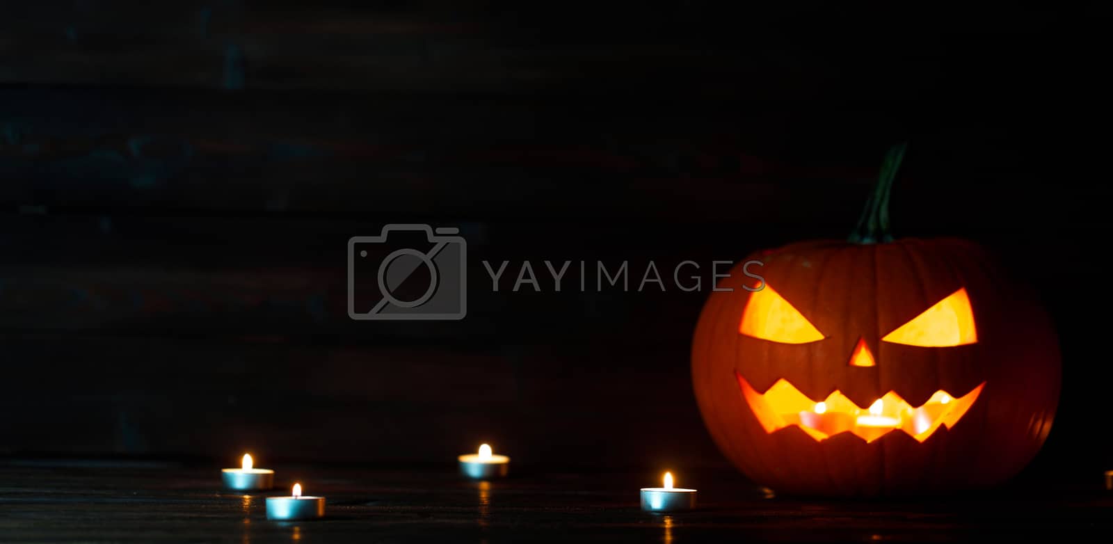 Royalty free image of Halloween pumpkin and candles by Yellowj