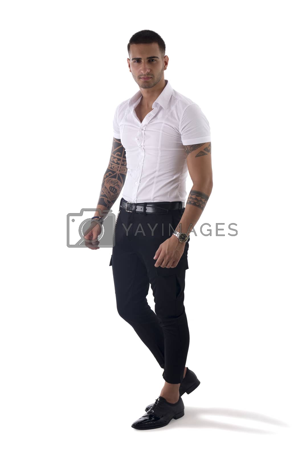 Royalty free image of Young smiling man in white shirt and jeans isolated by artofphoto