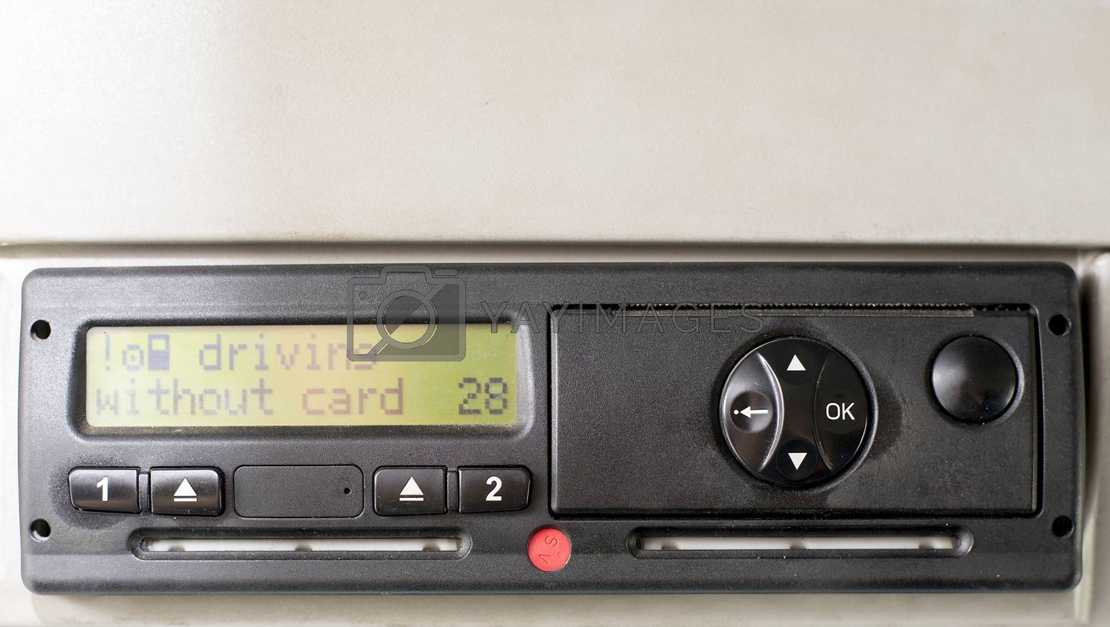 Royalty free image of Digital tachograph display reads DRIVING WITHOUT CARD. No inserted card in the device. Insert the drivers card. No personal data by vladiczech