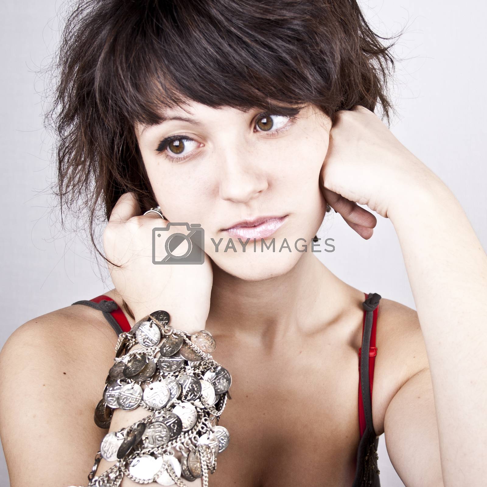 Royalty free image of Brunet woman with bracelets. by marylooo